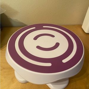 Wilton tilt-n-turn ultra cake turntable and cake stand.